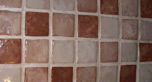 4x4 concrete cobblestone backsplash in tans.