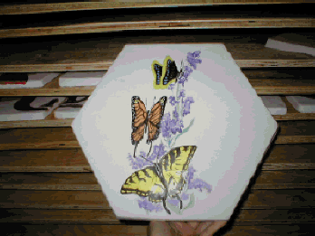 Hand-painted cement hexagon tile.