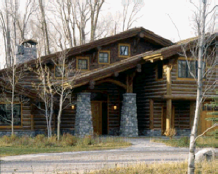 Concrete river rock stone pillars on log cabin.