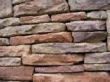 Drystack Ledgestone Stackstone walls cast with concrete.